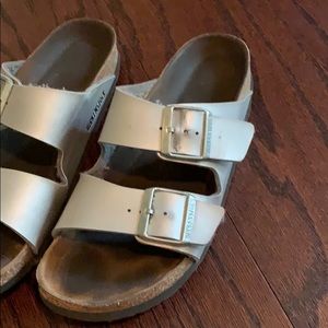 Birkenstock’s silver slip on sandals